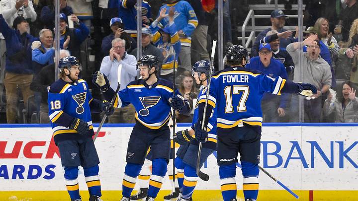 Mar 23, 2025; St. Louis, Missouri, USA;  St. Louis Blues center Alexandre Texier (9) is congratulated by center Robert Thomas (18) center Zack Bolduc (76) and defenseman Cam Fowler (17) after scoring against the Nashville Predators during the first period at Enterprise Center. Mandatory Credit: Jeff Curry-Imagn Images