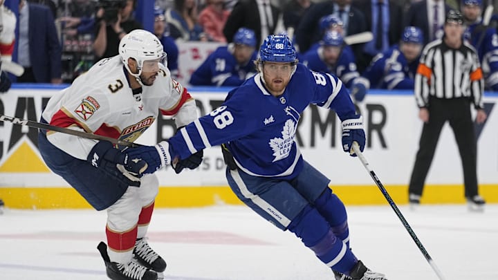 May 18, 2025; Toronto, Ontario, CAN; Toronto Maple Leafs forward William Nylander (88) controls the puck against Florida Panthers defenseman Seth Jones (3) during the first period of game seven of the second round of the 2025 Stanley Cup Playoffs at Scotiabank Arena. 