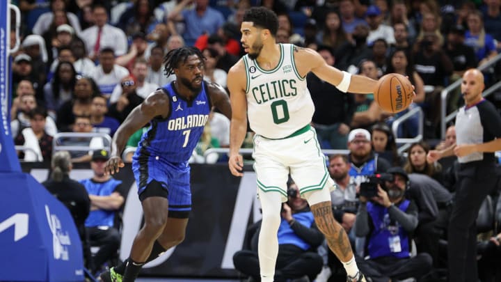 Oct 22, 2022; Orlando, Florida, USA;  Orlando Magic guard Kevon Harris (7) guards Boston Celtics forward Jayson Tatum (0) in the third quarter at Amway Center. 