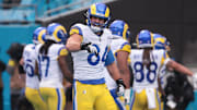 Nov 30, 2025; Charlotte, North Carolina, USA; Los Angeles Rams tight end Colby Parkinson (84) celebrates after a play during the fourth quarter against the Carolina Panthers at Bank of America Stadium. Mandatory Credit: Scott Kinser-Imagn Images