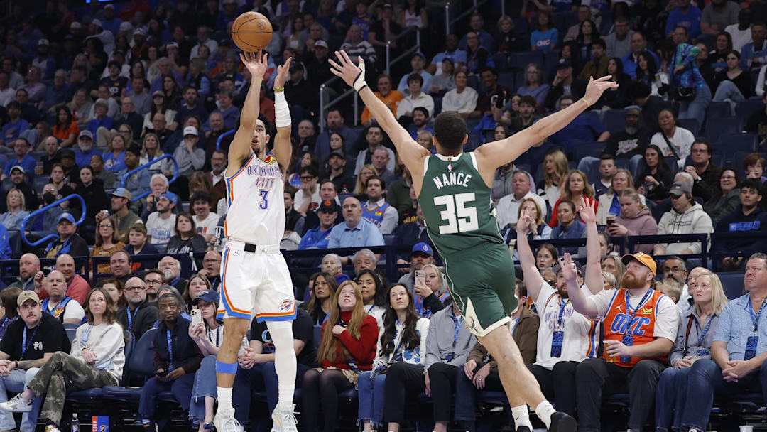 Feb 12, 2026; Oklahoma City, Oklahoma, USA; Oklahoma City Thunder guard Jared McCain (3) shoots a three point basket as Milwaukee Bucks forward Pete Nance (35) defends during the second half at Paycom Center. Mandatory Credit: Alonzo Adams-Imagn Images
