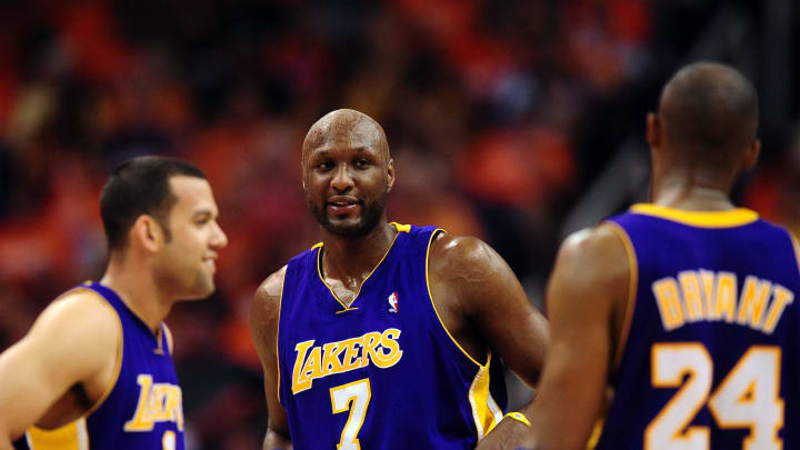 May 23, 2010; Phoenix, AZ, USA; Los Angeles Lakers forward Lamar Odom (7)  talks with teammates Jordan Farmar (1) and Kobe Bryant (24) during the fourth quarter in game three of the western conference finals in the 2010 NBA Playoffs against the Phoenix Suns at US Airways Center.  The Suns defeated the Lakers 118-109.   Mandatory Credit: Jennifer Stewart-USA TODAY Sports