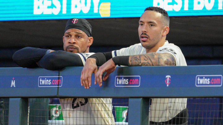 Jul 7, 2023; Minneapolis, Minnesota, USA; Minnesota Twins designated hitter Byron Buxton (25) and shortstop Carlos Correa (4) watch play in the bottom of the seventh inning against the Baltimore Orioles at Target Field. Mandatory Credit: Matt Blewett-USA TODAY Sports