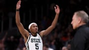 Mar 28, 2025; Atlanta, GA, USA; Michigan State Spartans guard Tre Holloman (5) reacts after a play in the second half of a South Regional semifinal of the 2025 NCAA tournament against the Mississippi Rebels at State Farm Arena. Mandatory Credit: Brett Davis-Imagn Images