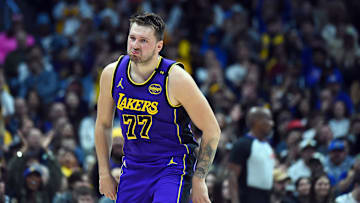 Feb 22, 2025; Denver, Colorado, USA; Los Angeles Lakers guard Luka Doncic (77) celebrates after a basket during the first half against the Denver Nuggets at Ball Arena. Mandatory Credit: Christopher Hanewinckel-Imagn Images