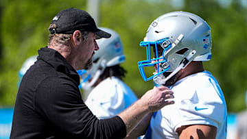 Detroit Lions head coach Dan Campbell talks to defensive lineman Breiden Fehoko (76) during rookie mini camp at Meijer Performance Center in Allen Park on Friday, May 9, 2025.