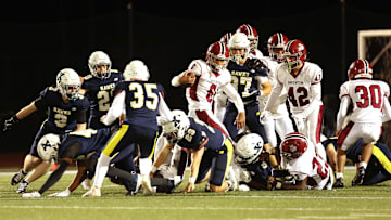 Brockton's Jarred Mighty carries the football during a Div. 1 Round of 16 football game against Xaverian on Friday, Nov. 8, 2024.