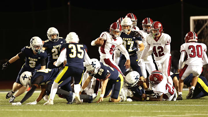 Brockton's Jarred Mighty carries the football during a Div. 1 Round of 16 football game against Xaverian on Friday, Nov. 8, 2024. Brockton's Jarred Mighty carries the football during a Div. 1 Round of 16 football game against Xaverian on Friday, Nov. 8, 2024.