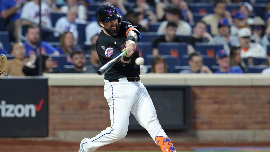 May 24, 2024; New York City, New York, USA; New York Mets catcher Tomas Nido (3) hits an RBI sacrifice fly during the fourth inning against the San Francisco Giants at Citi Field.