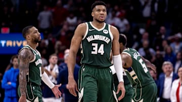 Mar 28, 2024; New Orleans, Louisiana, USA;   Milwaukee Bucks forward Giannis Antetokounmpo (34) and guard Damian Lillard (0) head to the bench on a timer out against the New Orleans Pelicans during the second half at Smoothie King Center. Mandatory Credit: Stephen Lew-Imagn Images