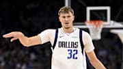 Oct 6, 2025; Fort Worth, Texas, USA; Dallas Mavericks forward Cooper Flagg (32) sets the play as he brings the ball up the court against the Oklahoma City Thunder during the second quarter at Dickie's Arena. Mandatory Credit: Jerome Miron-Imagn Images