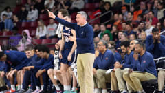 Tony Bennett directs his team during the Virginia men's basketball game against Boston College at Conte Forum.