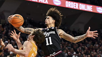 Feb 22, 2025; College Station, Texas, USA; Texas A&M Aggies forward Andersson Garcia (11) grabs the rebound over Tennessee Volunteers forward Cade Phillips (12) during the second half at Reed Arena. Mandatory Credit: Maria Lysaker-Imagn Images 