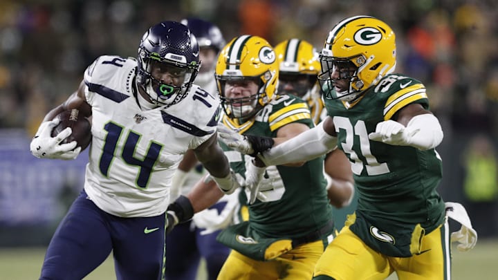 Seattle Seahawks wide receiver D.K. Metcalf (14) tries to get away from Green Bay Packers during the 2019 playoffs.
