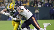 Packers tight end Tucker Kraft is tackled by T.J. Edwards in Green Bay last season.