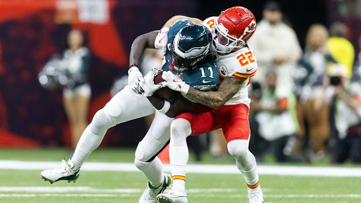 Feb 9, 2025; New Orleans, LA, USA; Philadelphia Eagles wide receiver A.J. Brown (11) is tackled by Kansas City Chiefs cornerback Trent McDuffie (22) during Super Bowl LIX at Ceasars Superdome. Mandatory Credit: Mark J. Rebilas-Imagn Images