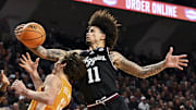 Texas A&M Aggies forward Andersson Garcia (11) grabs the rebound over Tennessee Volunteers forward Cade Phillips (12) during the second half at Reed Arena.
