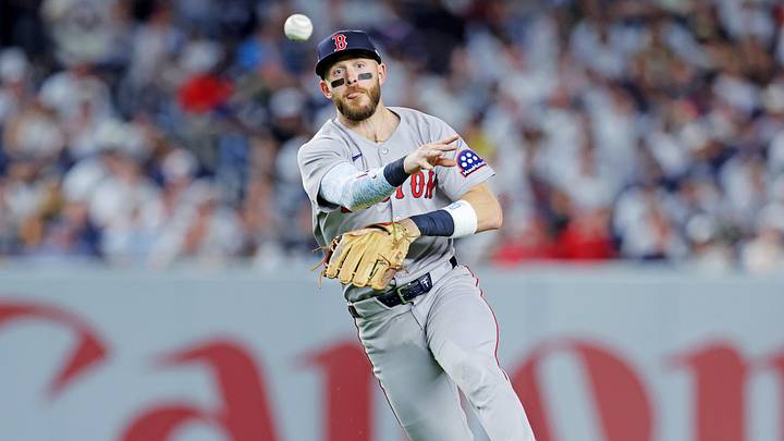 Sep 30, 2025; Bronx, New York, USA; Boston Red Sox shortstop Trevor Story (10) throws out New York Yankees third base Amed Rosario (14) during the fourth inning during game one of the Wildcard round for the 2025 MLB playoffs at Yankee Stadium. Mandatory Credit: Brad Penner-Imagn Images