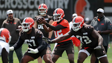 Browns quarterback Shedeur Sanders takes a snap during minicamp, Tuesday, June 10, 2025, in Berea.