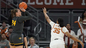 Jan 30, 2025; Austin, Texas, USA; Missouri Tigers guard Ashton Judd (24) shoots over Texas Longhorns forward Madison Booker (35) during the first half at Moody Center. Mandatory Credit: Scott Wachter-Imagn Images