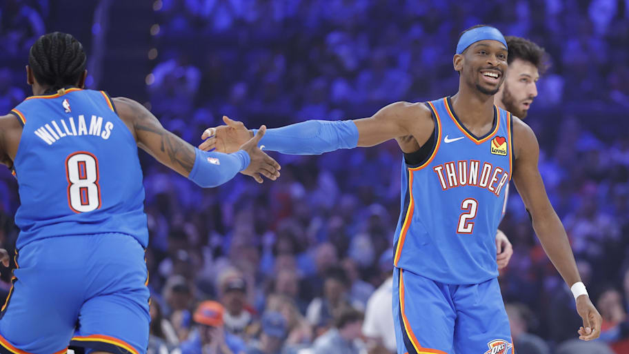 Oklahoma City Thunder guard Shai Gilgeous-Alexander celebrates with teammate Jalen Williams.