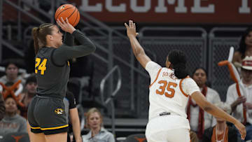 Jan 30, 2025; Austin, Texas, USA; Missouri Tigers guard Ashton Judd (24) shoots over Texas Longhorns forward Madison Booker (35) during the first half at Moody Center.