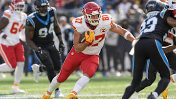 Nov 24, 2024; Charlotte, North Carolina, USA; Kansas City Chiefs tight end Travis Kelce (87) runs for yards after the catch during the first quarter against the Carolina Panthers at Bank of America Stadium. Mandatory Credit: Jim Dedmon-Imagn Images