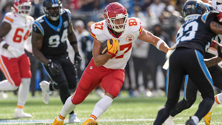 Nov 24, 2024; Charlotte, North Carolina, USA; Kansas City Chiefs tight end Travis Kelce (87) runs for yards after the catch during the first quarter against the Carolina Panthers at Bank of America Stadium. Mandatory Credit: Jim Dedmon-Imagn Images