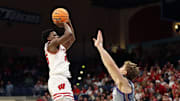 Nov 28, 2025; San Diego, CA, USA; Wisconsin Badgers guard John Blackwell (25) shoots the ball against Texas Christian University Horned Frogs during the first half at Jenny Craig Pavilion. 