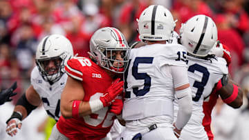Oct 21, 2023; Columbus, Ohio, USA; Ohio State Buckeyes defensive end Caden Curry (92) hits Penn State Nittany Lions quarterback Drew Allar (15) during the NCAA football game at Ohio Stadium.