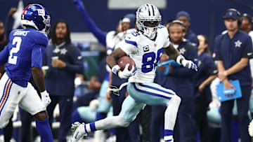 Sep 14, 2025; Arlington, Texas, USA; Dallas Cowboys wide receiver CeeDee Lamb (88) runs with the ball against the New York Giants during the second quarter at AT&T Stadium. Mandatory Credit: Kevin Jairaj-Imagn Images