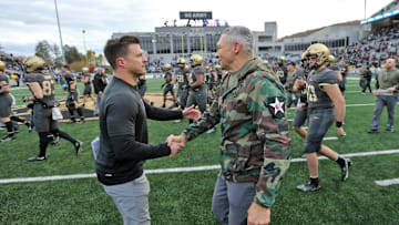 Nov 11, 2023; West Point, New York, USA; Army Black Knights head coach Jeff Monken greets Holy Cross Crusaders head coach Bob Chesney after as 17-14 win at Michie Stadium. Mandatory Credit: Danny Wild-Imagn Images
