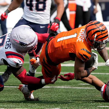 Cincinnati Bengals wide receiver Ja'Marr Chase (1) makes a catch past New England Patriots safety Jabrill Peppers (5) and safety Kyle Dugger (23) at Paycor Stadium Sunday, September 8, 2024. The Patriots beat the Bengals 16-10.