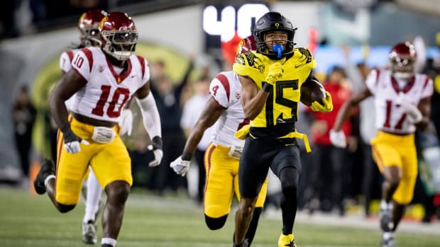 Oregon wide receiver Tez Johnson returns a pass for a touchdown as the No. 6 Oregon Ducks host the USC Trojans Saturday, Nov.