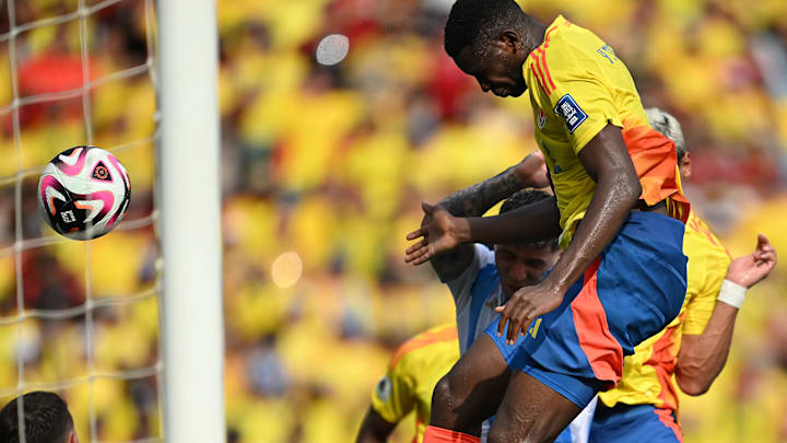 Yerson Mosquera heads home from a corner against Argentina 