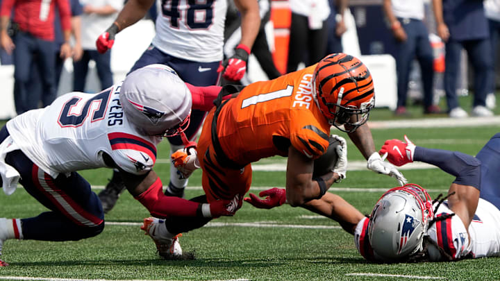 Cincinnati Bengals wide receiver Ja'Marr Chase (1) makes a catch past New England Patriots safety Jabrill Peppers (5) and safety Kyle Dugger (23) at Paycor Stadium Sunday, September 8, 2024. The Patriots beat the Bengals 16-10.