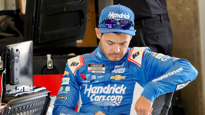 NASCAR Cup Series driver Kyle Larson (5) sits in his garage Friday, July 19, 2024, as Xfinity series drivers practice for the Pennzoil 250 at Indianapolis Motor Speedway.