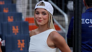 LSU former gymnast Olivia Dunne on the field before a game between the New York Mets and the Pittsburgh Pirates at Citi Field.