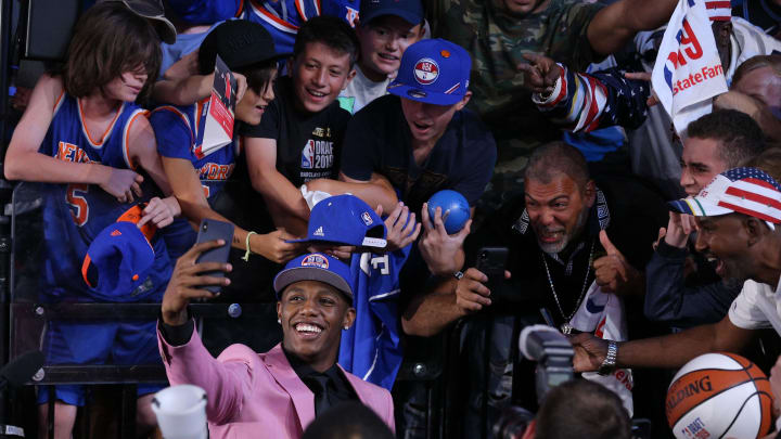 Jun 20, 2019; Brooklyn, NY, USA; RJ Barrett (Duke) takes a selfie with fans in the stands after being selected as the number three overall pick to the New York Knicks in the first round first round of the 2019 NBA Draft at Barclays Center. Mandatory Credit: Brad Penner-USA TODAY Sports