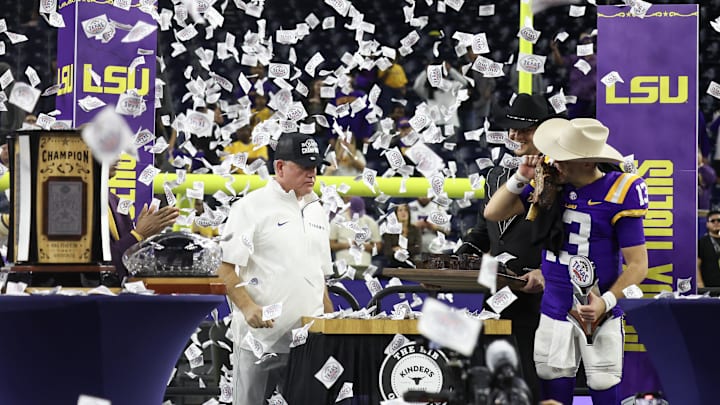 LSU Tigers head coach Brian Kelly watches quarterback Garrett Nussmeier eat after defeating the Baylor Bears in the Kinder’s Texas Bowl in the second half at NRG Stadium. 