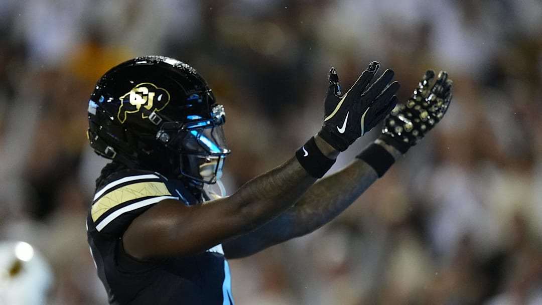 Sep 20, 2025; Boulder, Colorado, USA; Colorado Buffaloes wide receiver Omarion Miller (4) celebrates a touchdown reception in second quarter against the Wyoming Cowboys at Folsom Field. Mandatory Credit: Ron Chenoy-Imagn Images