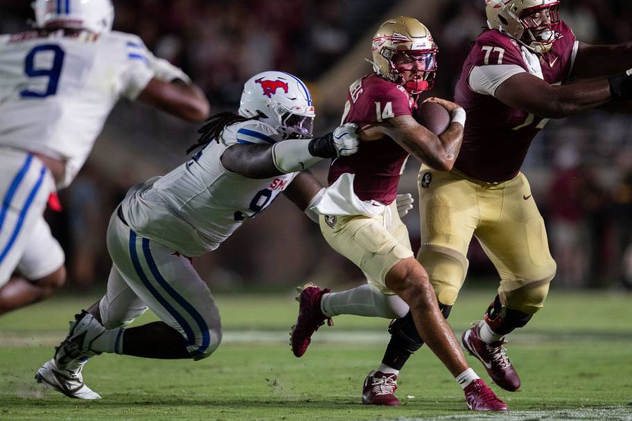Florida State quarterback Ashton Daniels tries to outrun an SMU tackle on Monday. 