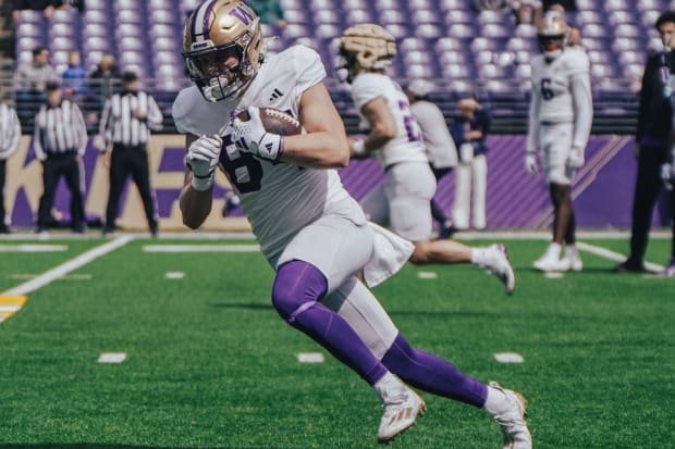 Jackson Girouard heads upfield during UW spring ball. 