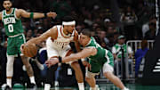 Apr 4, 2025; Boston, Massachusetts, USA; Boston Celtics guard Payton Pritchard (11) tries to knock the ball away from Phoenix Suns guard Devin Booker (1) during the first quarter at TD Garden. Mandatory Credit: Winslow Townson-Imagn Images
