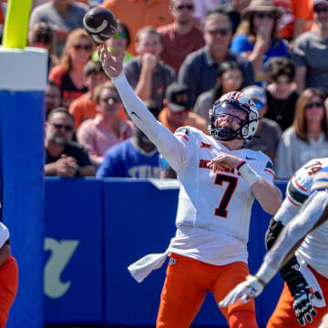 Oklahoma State quarterback Alan Bowman (7) throws the ball for a touchdown in the first half during an NCAA football game between Oklahoma State and Tulsa in Tulsa, Okla., on Saturday, Sept. 14, 2024.