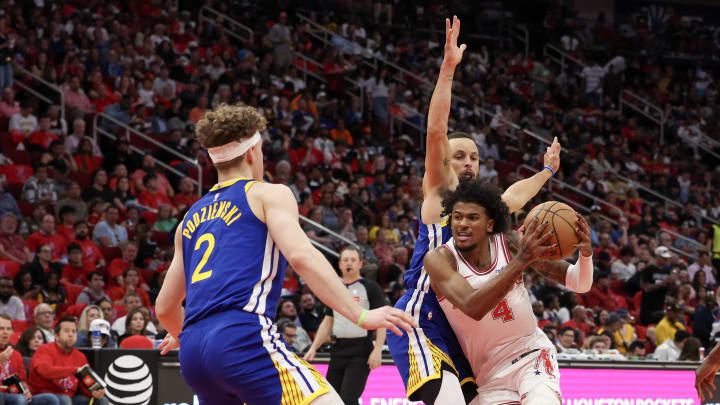 Apr 4, 2024; Houston, Texas, USA; Houston Rockets guard Jalen Green (4) drives against Golden State Warriors guard Stephen Curry (30)  in the second half at Toyota Center. Mandatory Credit: Thomas Shea-USA TODAY Sports