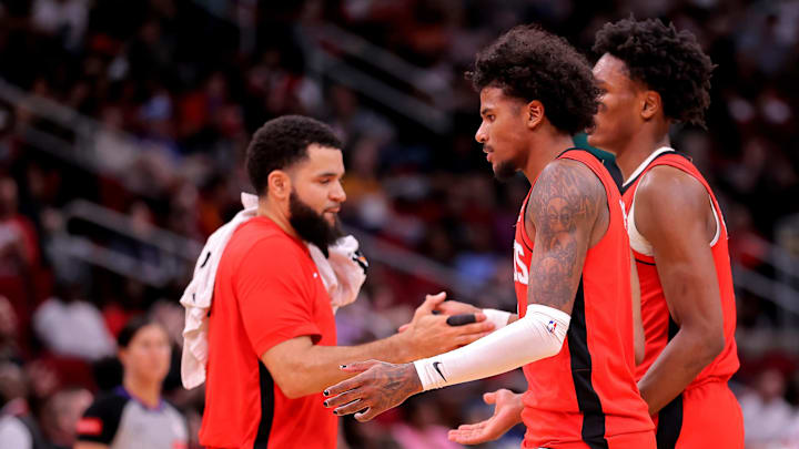 Mar 25, 2024; Houston, Texas, USA; Houston Rockets guard Jalen Green (4) is congratulated by Houston Rockets guard Fred VanVleet (5) during a timeout against the Portland Trail Blazers during the third quarter at Toyota Center. Mandatory Credit: Erik Williams-Imagn Images