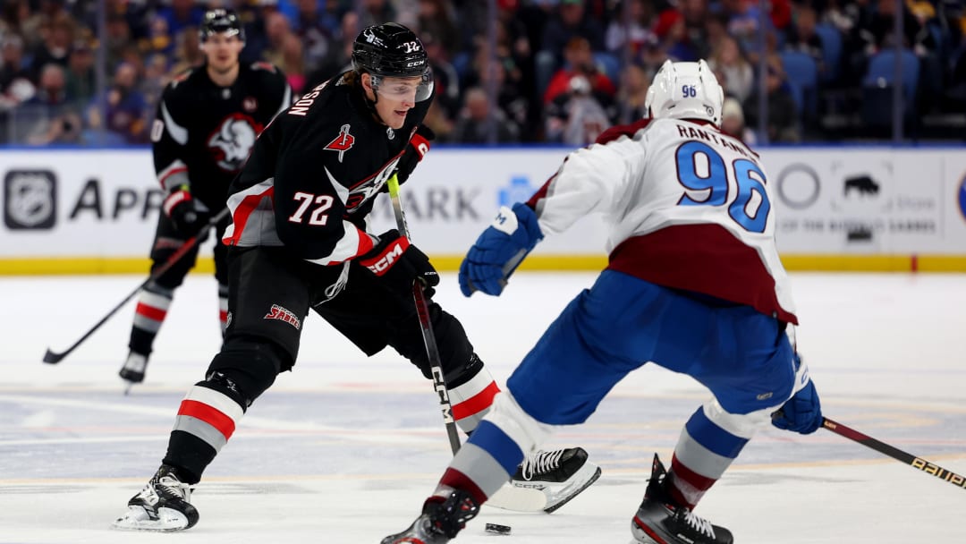 Oct 29, 2023; Buffalo, New York, USA;  Buffalo Sabres right wing Tage Thompson (72) carries the puck as Colorado Avalanche right wing Mikko Rantanen (96) defends during the second period at KeyBank Center. Mandatory Credit: Timothy T. Ludwig-USA TODAY Sports