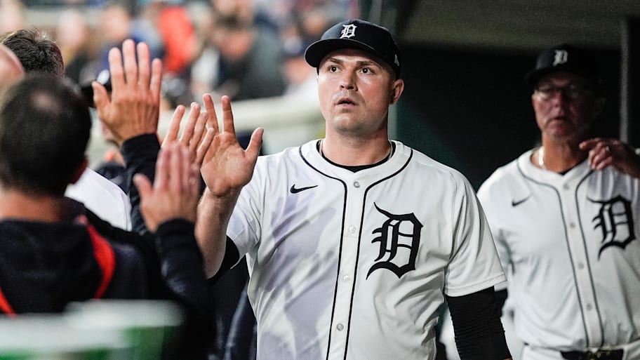 Detroit Tigers pitcher Tarik Skubal high-fives teammates.
