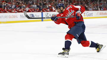 Mar 7, 2025; Washington, District of Columbia, USA; Washington Capitals left wing Alex Ovechkin (8) shoots the puck against the Detroit Red Wings in the third period at Capital One Arena. Mandatory Credit: Geoff Burke-Imagn Images